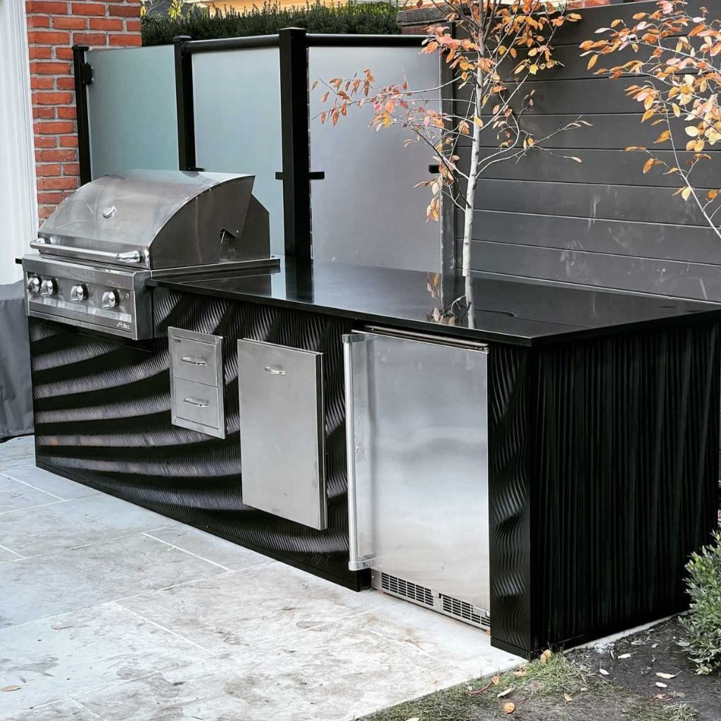 outdoor kitchen with parametric walls feature